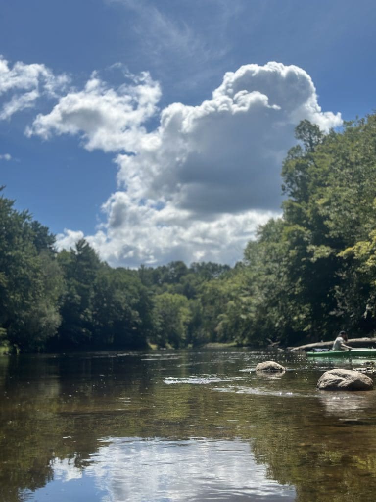 A kayaker enjoys the Muskegon River by Riverside Park in Big Rapids